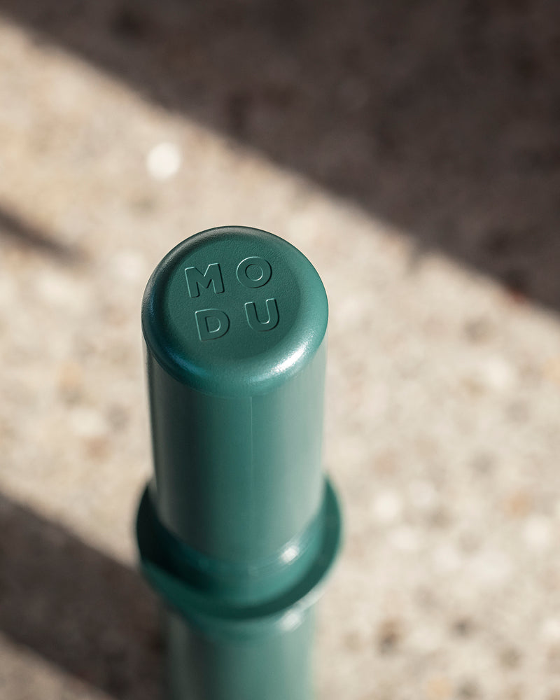 MODU connector peg in color forest green. Fully recyclable and non-toxic.