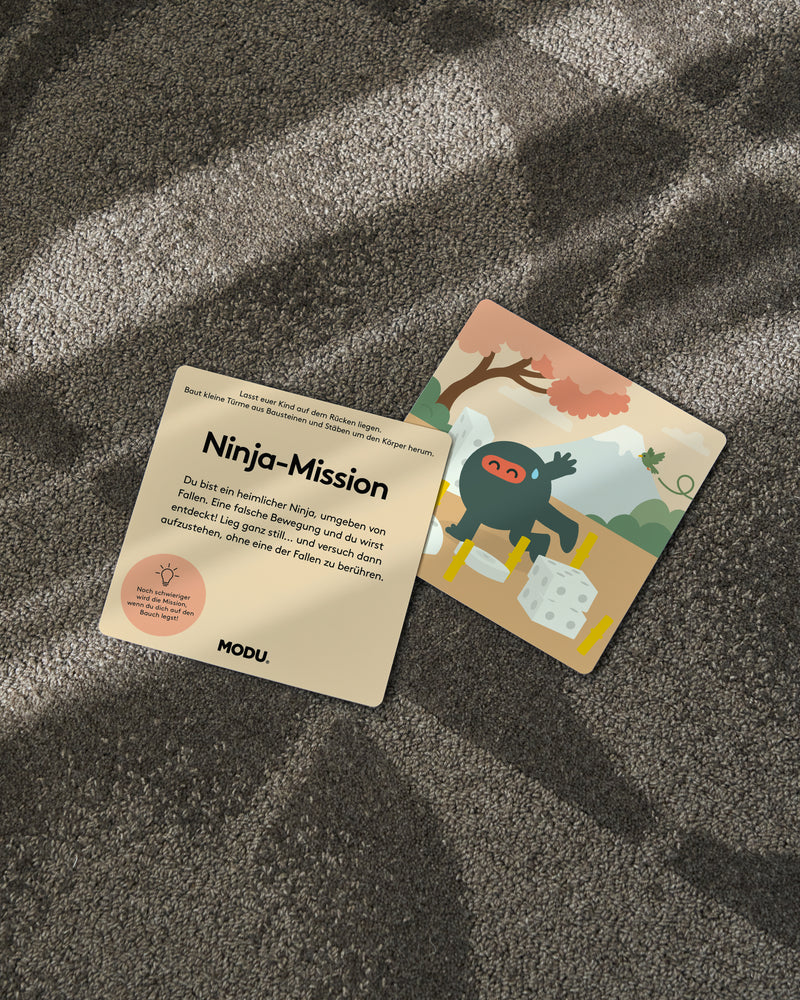 A close-up view of a “Ninja Mission” card from the MODU Play Cards set, showing an active play activity for children.