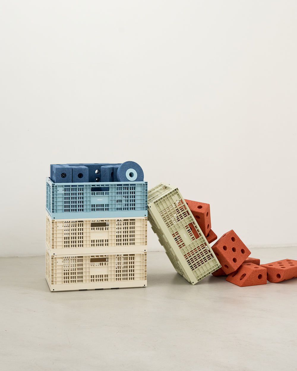Stack of plastic crates with a minimal background