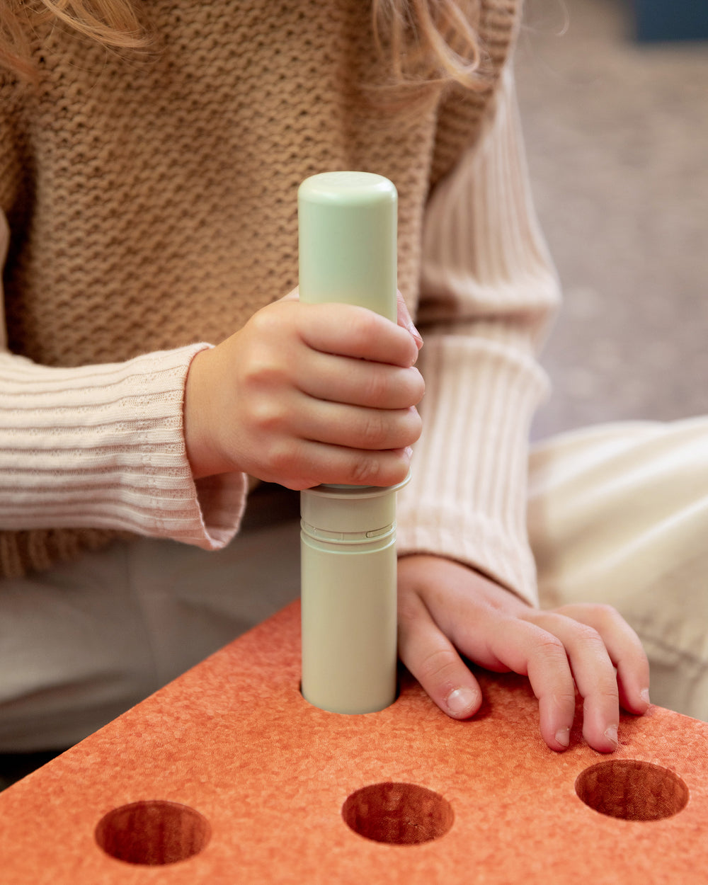Toddler building with MODU. Life-sized building toy for open-ended creative play.