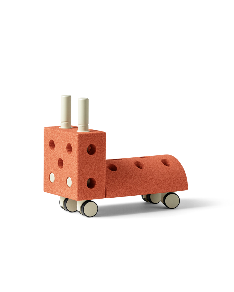 MODU Tiny Ride, ride-on toy for babies and toddlers, in the color Burnt Orange Dusty Green.